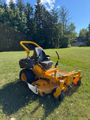 side photo with the discharge area of the mower showing